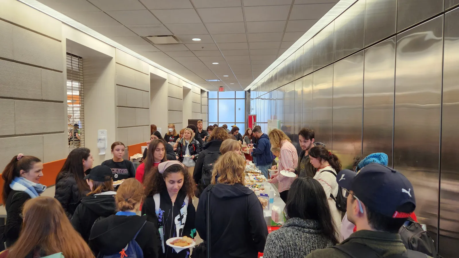 students getting food in a line at kapusstnik